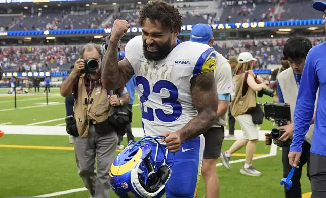 Los Angeles Rams running back Kyren Williams (23) celebrates after the Rams defeated the San Francisco 49ers in an NFL football game, Sunday, Sept. 22, 2024, in Inglewood, Calif. (AP Photo/Ashley Landis)