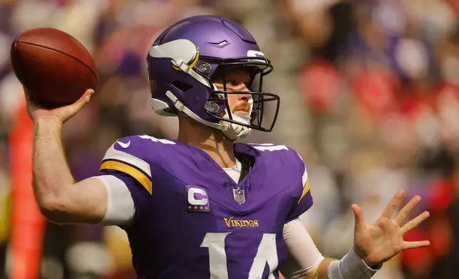 Minnesota Vikings quarterback Sam Darnold (14) throws a pass during the second half of an NFL football game against the San Francisco 49ers, Sunday, Sept. 15, 2024, in Minneapolis. (AP Photo/Bruce Kluckhohn)