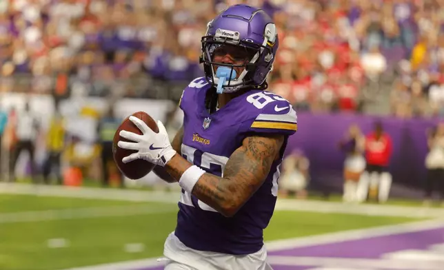 Minnesota Vikings wide receiver Jalen Nailor (83) catches a 10-yard touchdown pass during the second half of an NFL football game against the San Francisco 49ers, Sunday, Sept. 15, 2024, in Minneapolis. (AP Photo/Bruce Kluckhohn)