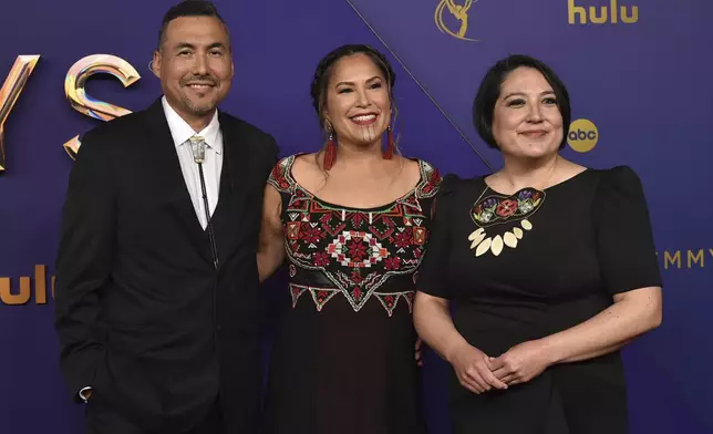 James Johnson, from left, Princess Daazhraii Johnson, and Cathy Tagnak Rexford arrive at the 76th Primetime Emmy Awards on Sunday, Sept. 15, 2024, at the Peacock Theater in Los Angeles. (Photo by Richard Shotwell/Invision/AP)