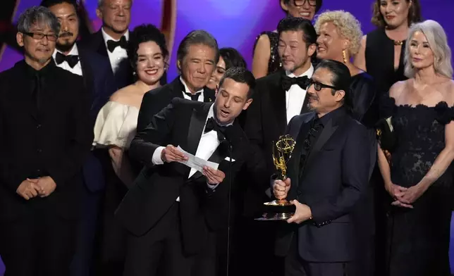 Justin Marks, center, Hiroyuki Sanada, and the team from "Shogun" accept the award for outstanding drama series during the 76th Primetime Emmy Awards on Sunday, Sept. 15, 2024, at the Peacock Theater in Los Angeles. (AP Photo/Chris Pizzello)