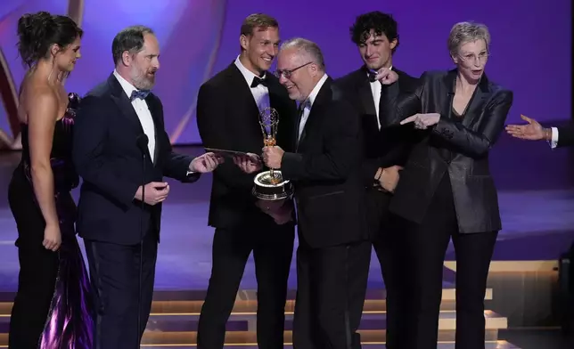 Ilona Mahler, from left, Brendan Hunt, Caeleb Dressel, Ezra Frech, and Jane Lynch present the award for outstanding directing for a drama series to Frederick E.O. Toye, center, for "Shogun" during the 76th Primetime Emmy Awards on Sunday, Sept. 15, 2024, at the Peacock Theater in Los Angeles. (AP Photo/Chris Pizzello)