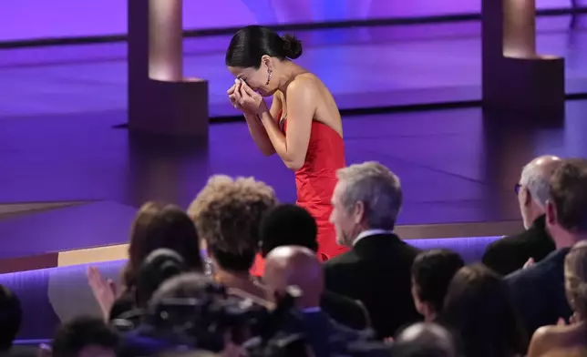 Anna Sawai wipes her tears as she accepts the award for outstanding lead actress in a drama series for "Shogun" during the 76th Primetime Emmy Awards on Sunday, Sept. 15, 2024, at the Peacock Theater in Los Angeles. (AP Photo/Chris Pizzello)