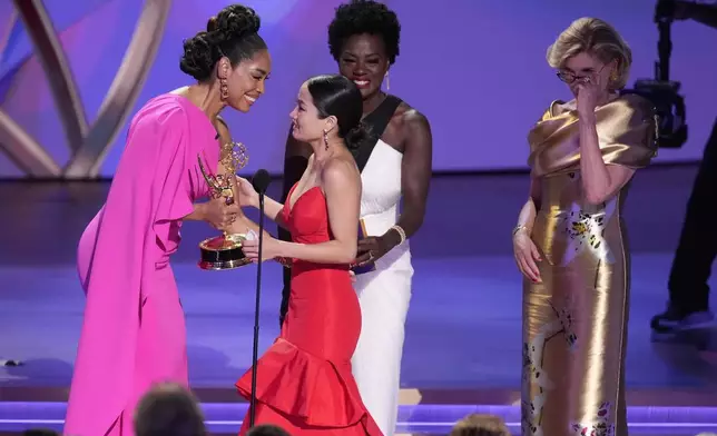 Gina Torres, far left, Viola Davis, center, and Christine Baranski present the award for outstanding lead actress in a drama series to Anna Sawai for "Shogun" during the 76th Primetime Emmy Awards on Sunday, Sept. 15, 2024, at the Peacock Theater in Los Angeles. (AP Photo/Chris Pizzello)