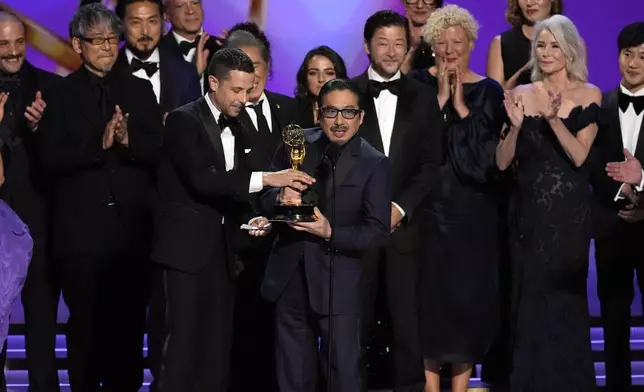 Justin Marks, left center, and Hiroyuki Sanada, center right, and the team from "Shogun" accepts the award for outstanding drama series during the 76th Primetime Emmy Awards on Sunday, Sept. 15, 2024, at the Peacock Theater in Los Angeles. (AP Photo/Chris Pizzello)