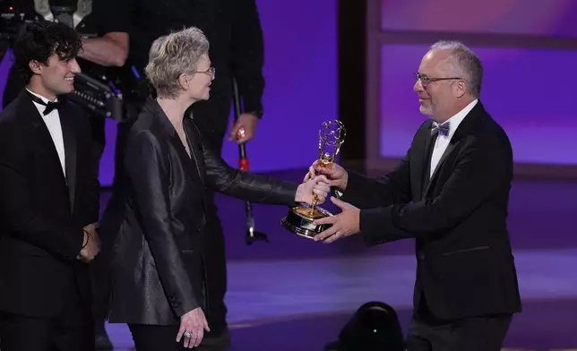 Ezra Frech, from left, and Jane Lynch present the award for outstanding directing for a drama series to Frederick E.O. Toye for "Shogun" during the 76th Primetime Emmy Awards on Sunday, Sept. 15, 2024, at the Peacock Theater in Los Angeles. (AP Photo/Chris Pizzello)