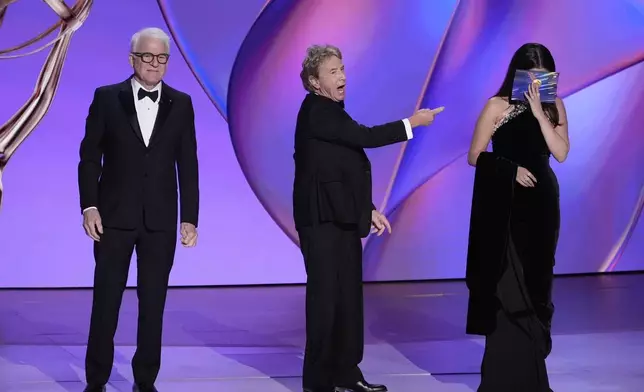 Steve Martin, from left, Martin Short, and Selena Gomez present the award for outstanding supporting actor in a comedy series during the 76th Primetime Emmy Awards on Sunday, Sept. 15, 2024, at the Peacock Theater in Los Angeles. (AP Photo/Chris Pizzello)