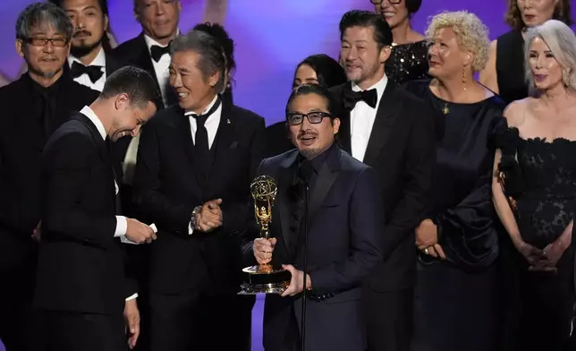 Hiroyuki Sanada, center, and the team from "Shogun" accepts the award for outstanding drama series during the 76th Primetime Emmy Awards on Sunday, Sept. 15, 2024, at the Peacock Theater in Los Angeles. (AP Photo/Chris Pizzello)