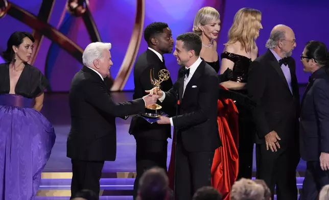 Martin Sheen, far left, Dule Hill, Allison Janney, Janel Moloney, and Richard Schiff present the award for outstanding drama series to Justin Marks, center, and Hiroyuki Sanda for "Shogun" during the 76th Primetime Emmy Awards on Sunday, Sept. 15, 2024, at the Peacock Theater in Los Angeles. (AP Photo/Chris Pizzello)