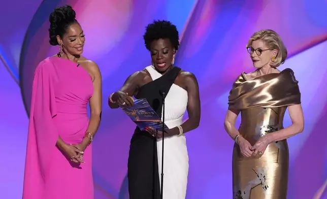 Gina Torres, from left, Viola Davis, and Christine Baranski present the award for outstanding lead actress in a drama series during the 76th Primetime Emmy Awards on Sunday, Sept. 15, 2024, at the Peacock Theater in Los Angeles. (AP Photo/Chris Pizzello)