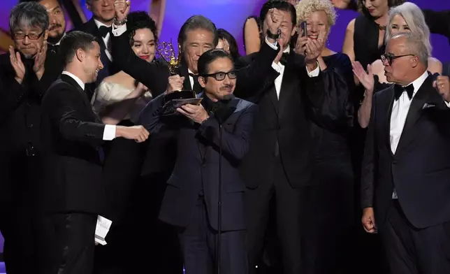 Justin Marks, left center, and Hiroyuki Sanada, center right, and the team from "Shogun" accepts the award for outstanding drama series during the 76th Primetime Emmy Awards on Sunday, Sept. 15, 2024, at the Peacock Theater in Los Angeles. (AP Photo/Chris Pizzello)