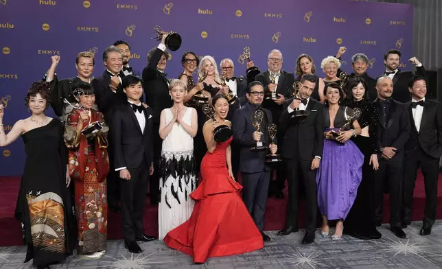 Hiroyuki Sanada, center, winner of the award for outstanding lead actor in a drama series for "Shogun" poses in the press room with the team from "Shogun", winners for award for for outstanding drama series, during the 76th Primetime Emmy Awards on Sunday, Sept. 15, 2024, at the Peacock Theater in Los Angeles. (AP Photo/Jae C. Hong)