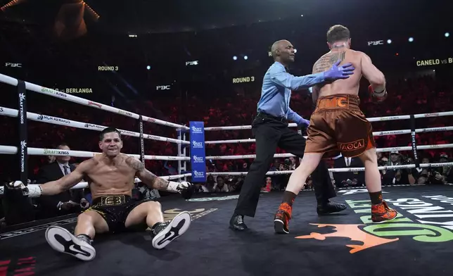 Canelo Alvarez knocks down Edgar Berlanga in a super middleweight title bout Saturday, Sept. 14, 2024, in Las Vegas. (AP Photo/John Locher)