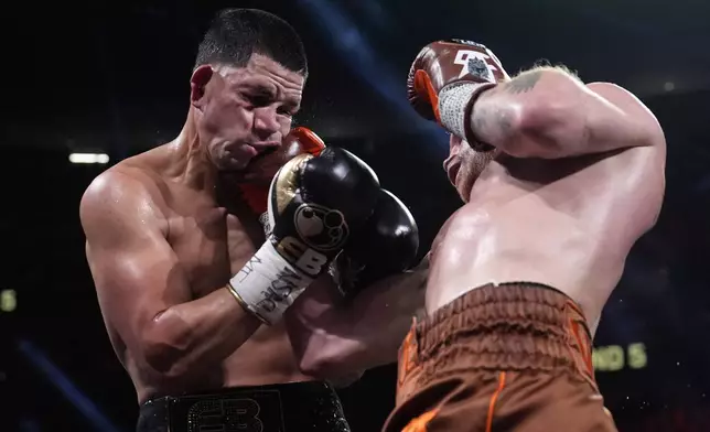 Canelo Alvarez lands a right to Edgar Berlanga in a super middleweight title bout Saturday, Sept. 14, 2024, in Las Vegas. (AP Photo/John Locher)