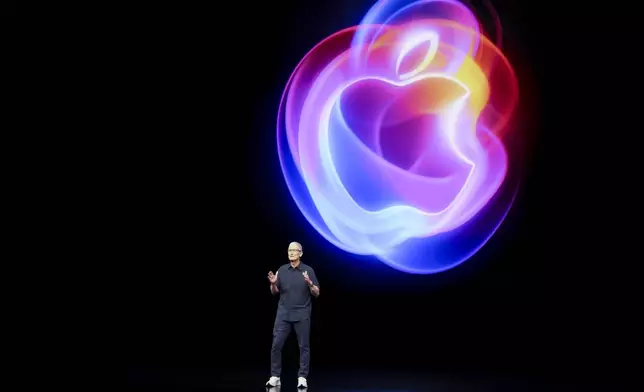 Apple CEO Tim Cook talks on the stage during an announcement of new products at Apple headquarters Monday, Sept. 9, 2024, in Cupertino, Calif. (AP Photo/Juliana Yamada)