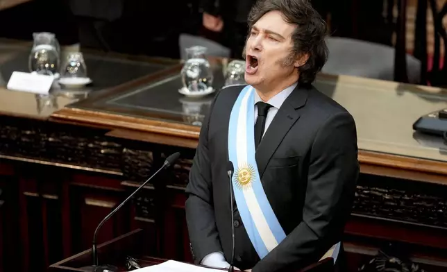 Argentina's President Javier Milei sings the national anthem as he addresses Congress to present the 2025 budget in Buenos Aires, Argentina, Sunday, Sept. 15, 2024. (AP Photo/Natacha Pisarenko)