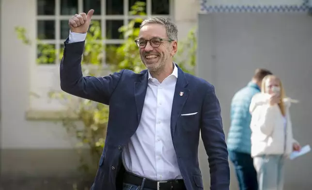 Herbert Kickl, leader of the Freedom Party of Austria gives a thumbs-up as he arrives at a polling station in Purkersdorf, Austria, Sunday, Sept. 29, 2024, to cast his vote in the country's national election. (AP Photo/Heinz-Peter Bader)