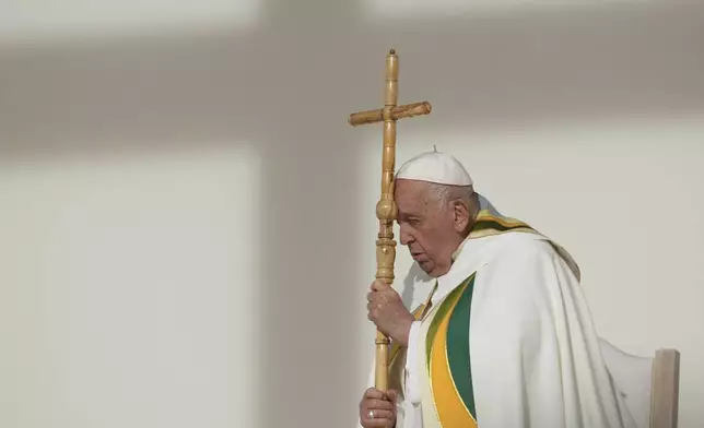 Pope Francis holds the pastoral staff as he presides over the Sunday mass at King Baudouin Stadium, in Brussels Sunday, Sept. 29, 2024. (AP Photo/Andrew Medichini)