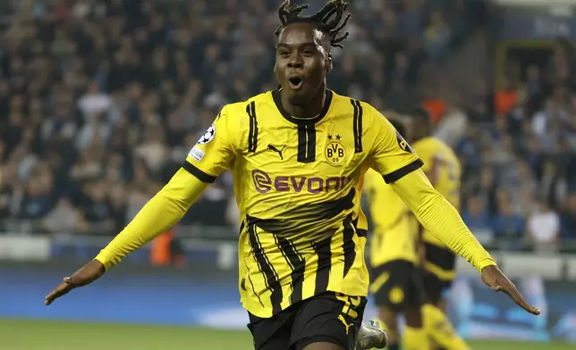 Dortmund's Jamie Gittens celebrates after he scored his second goal during the Champions League opening phase soccer match between Club Brugge and Borussia Dortmund at Jan Breydelstadion in Bruges, Belgium, Wednesday, Sept. 18, 2024. (AP Photo/Omar Havana)