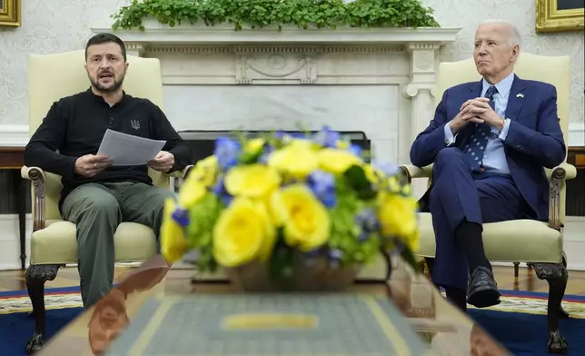 President Joe Biden, right, listens as Ukraine's President Volodymyr Zelenskyy, left, speaks during their meeting in the Oval Office of the White House in Washington, Thursday, Sept. 26, 2024. (AP Photo/Susan Walsh)