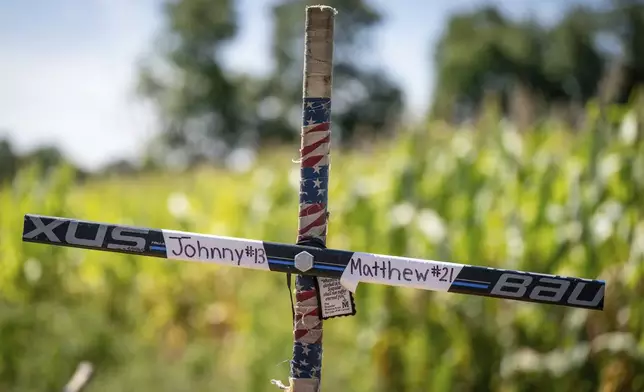 A memorial for Johnny and Matthew Gaudreau, who died last week when they were struck by a suspected drunken driver while riding bicycles, is shown in Salem County, N.J, Wednesday, Sept. 4, 2024.(Jessica Griffin/The Philadelphia Inquirer via AP)