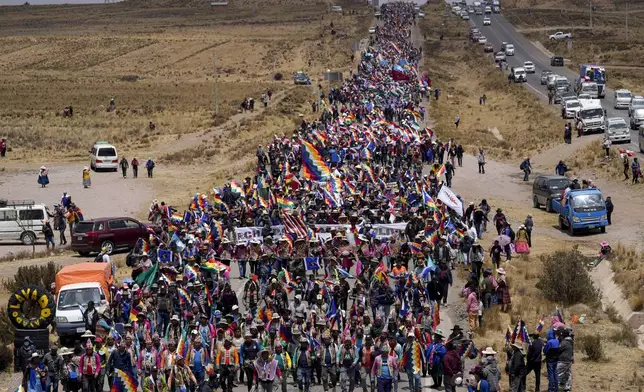 Supporters of former President Evo Morales march to the capital to protest the government of current President Luis Arce near El Alto, Bolivia, Sunday, Sept. 22, 2024. (AP Photo/Juan Karita)