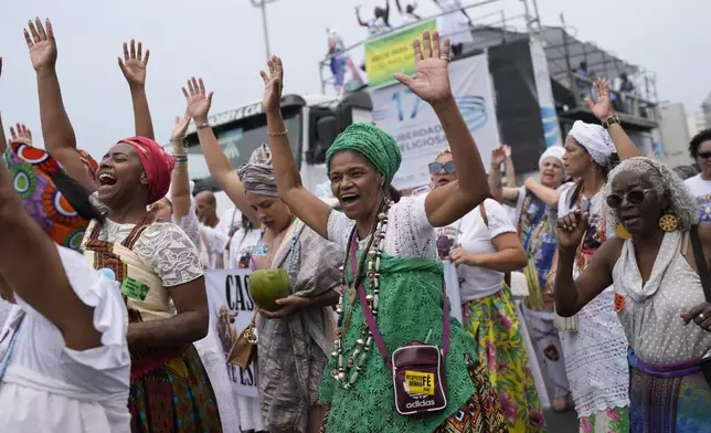 Faithful from various religions participate in the Defense of Religious Freedom march at Copacabana beach in Rio de Janeiro, Sunday, Sept. 15, 2024. The march seeks to bring attention to religious intolerance in the country. (AP Photo/Silvia Izquierdo)