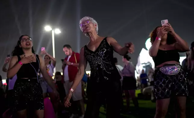 Fans attend the performance of Cyndi Lauper at the Rock in Rio music festival in Rio de Janeiro, Friday, Sept. 20, 2024. (AP Photo/Bruna Prado)