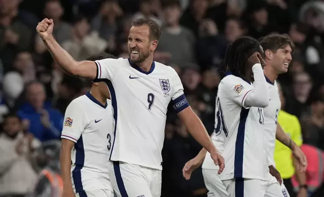 England's Harry Kane, left, celebrates after scoring his side's second goal during the Group F UEFA Nations League soccer match between England and Finland at Wembley Stadium in London, Tuesday, Sept. 10, 2024. (AP Photo/Frank Augstein)