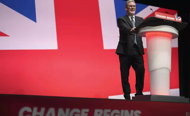 Britain's Prime Minister Keir Starmer addresses members at the Labour Party Conference in Liverpool, England, Tuesday, Sept. 24, 2024.(AP Photo/Jon Super)