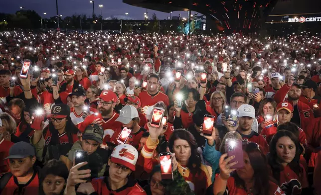 Fans attend a vigil for former Calgary Flames player Johnny Gaudreau and his brother Matthewin Calgary, Alberta, Wednesday, Sept. 4, 2024. (Jeff McIntosh/The Canadian Press via AP)