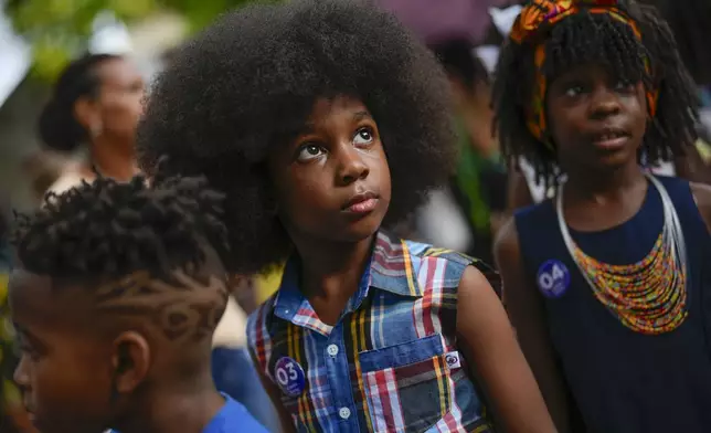 Children wait to walk the runway during a fashion show of Afro hairstyles in Havana, Cuba, Saturday, Aug. 31, 2024. (AP Photo/Ramon Espinosa)