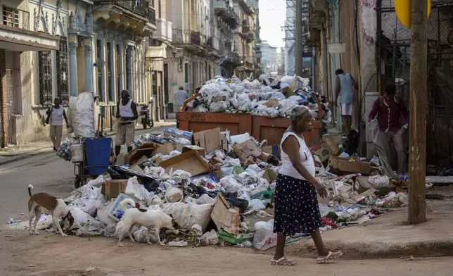 Garbage piles up on a corner in Havana, Cuba, Tuesday, Sept. 24, 2024. (AP Photo/Ramon Espinosa)