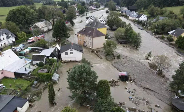 A view of flooded houses in Jesenik, Czech Republic, Sunday, Sept. 15, 2024. (AP Photo/Petr David Josek)