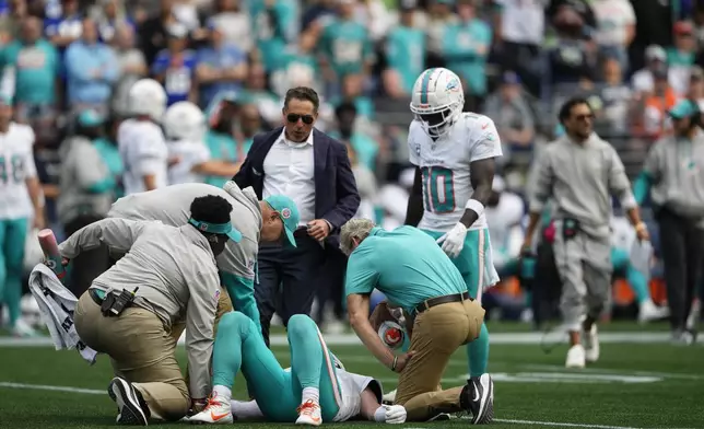 Miami Dolphins quarterback Skylar Thompson lies on the field after a play during the second half of an NFL football game against the Seattle Seahawks, Sunday, Sept. 22, 2024, in Seattle. (AP Photo/Lindsey Wasson)