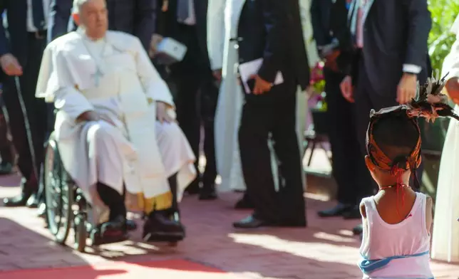 Pope Francis arrives at the 'Irmas ALMA' (Sisters of the Association of Lay Missionaries) School for Children with Disabilities in Dili, East Timor, Tuesday, Sept. 10, 2024. Pope Francis has indirectly acknowledged the abuse scandal in East Timor involving its Nobel Peace Prize-winning independence hero Bishop Carlos Filipe Ximenes Belo. (AP Photo/Gregorio Borgia)