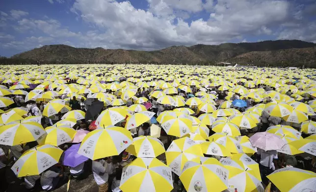 East Timorese crowd Tacitolu park for Pope Francis' Mass in Dili, East Timor, Tuesday, Sept. 10, 2024. (AP Photo/Firdia Lisnawati)