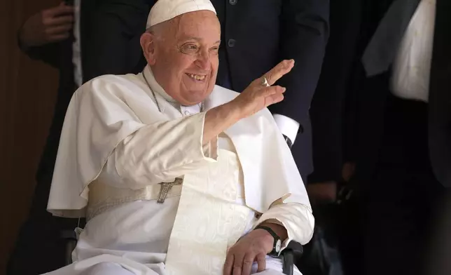 Pope Francis greets people in the Cathedral of the Immaculate Conception in Dili, East Timor, Tuesday, Sept. 10, 2024. (AP Photo/Dita Alangkara)