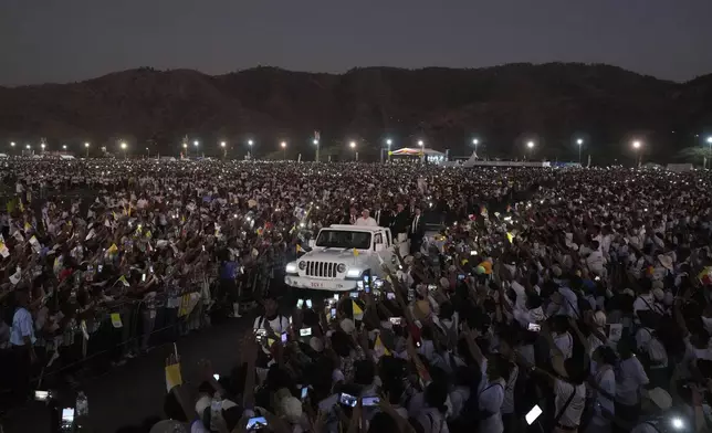 Pope Francis leaves after leading a holy mass at Tasitolu park in Dili, East Timor, Tuesday, Sept. 10, 2024. (AP Photo/Firdia Lisnawati)