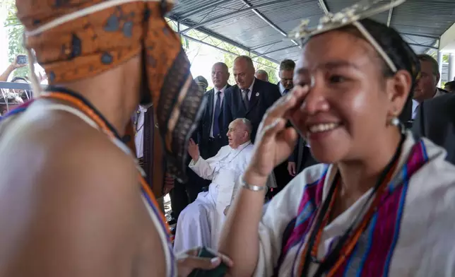 Pope Francis arrives at Dili's Presidente Nicolau Lobato International Airport, East Timor, Monday, Sept. 9, 2024. Pope Francis arrived in East Timor on Monday to encourage its recovery from a bloody and traumatic past and celebrate its development after two decades of independence from Indonesian rule. (AP Photo/Gregorio Borgia)