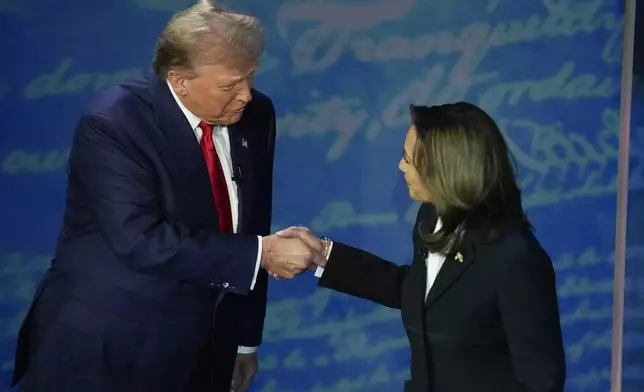 Republican presidential nominee former President Donald Trump and Democratic presidential nominee Vice President Kamala Harris shake hands before the start of an ABC News presidential debate at the National Constitution Center, Tuesday, Sept. 10, 2024, in Philadelphia. (AP Photo/Alex Brandon)