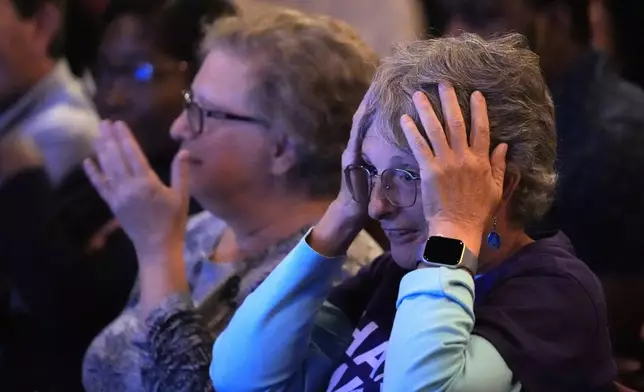 Karen Sellinger reacts to a comment by former President Donald Trump during the presidential debate between Trump and Democratic presidential nominee Vice President Kamala Harris, Tuesday, Sept. 10, 2024, in Portland, Maine. (AP Photo/Robert F. Bukaty)