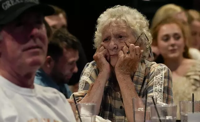 Former President Donald Trump supporter Pat Tuttle of Lebanon, Tenn., listens during the presidential debate between Vice President Kamala Harris and Republican presidential candidate Donald Trump at the Jonathan's Grille, Tuesday, Sept. 10, 2024, in Nashville, Tenn. (AP Photo/George Walker IV)