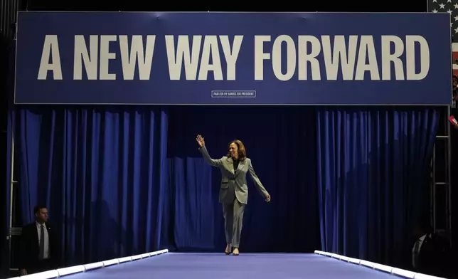 Democratic presidential nominee Vice President Kamala Harris walking on stage for a campaign rally, Friday, Sept. 20, 2024, in Madison, Wis. (AP Photo/Charlie Neibergall)