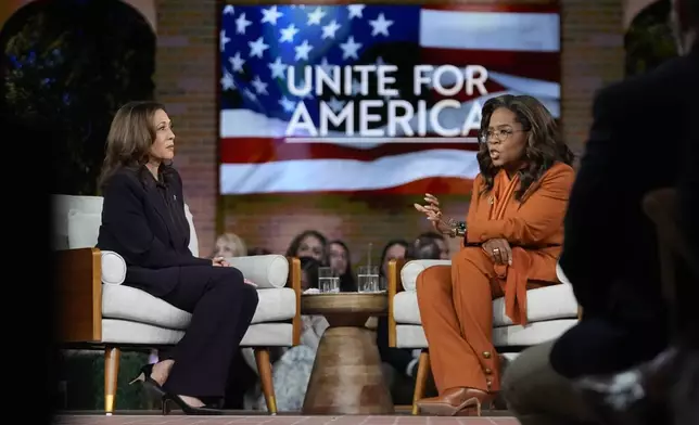 Democratic presidential nominee Vice President Kamala Harris joins Oprah Winfrey at Oprah's Unite for America Live Streaming event Thursday, Sept. 19, 2024 in Farmington Hills, Mich. (AP Photo/Paul Sancya)