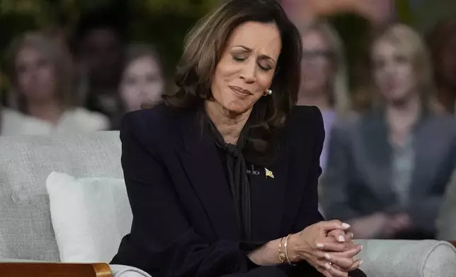 Democratic presidential nominee Vice President Kamala Harris listens to a parent's survivor story as she joins Oprah Winfrey at Oprah's Unite for America Live Streaming event Thursday, Sept. 19, 2024 in Farmington Hills, Mich. (AP Photo/Paul Sancya)