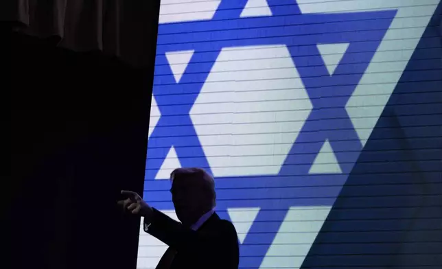 Republican presidential nominee former President Donald Trump acknowledges the crowd as he exits the stage after speaking at the Israeli American Council National Summit, Thursday, Sept. 19, 2024, in Washington. (AP Photo/Evan Vucci)