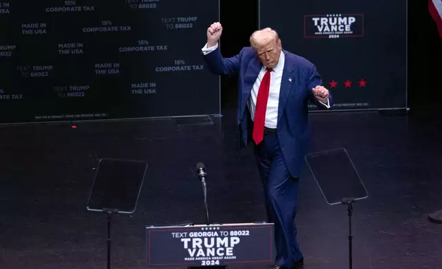 Republican presidential nominee former President Donald Trump dances after speaking at a campaign event Tuesday, Sept. 24, 2024, in Savannah, Ga. (AP Photo/John Bazemore)