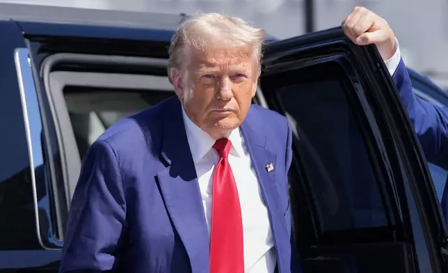 Republican presidential nominee former President Donald Trump arrives at Harry Reid International Airport to board a plane after a campaign trip, Saturday, Sept.14, 2024, in Las Vegas. (AP Photo/Alex Brandon)