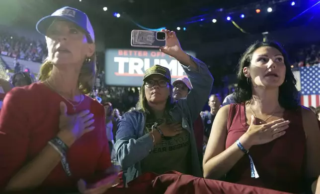 Supporters listen before Republican presidential nominee former President Donald Trump speaks during a town hall with former Democratic Rep. Tulsi Gabbard, Thursday, Aug. 29, 2024, in La Crosse, Wis. (AP Photo/Morry Gash)